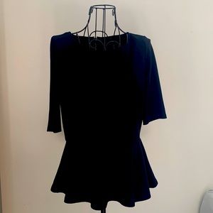 Black Top with peplum and back zipper in silver